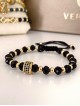 Bratara dama model deosebit cu margele aurii si negre si design cerc
