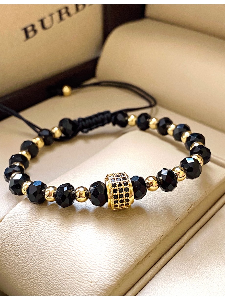 Bratara dama model deosebit cu margele aurii si negre si design cerc