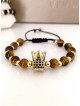 Bratara dama model deosebit cu piatra semipretioasa Ochi de tigru si design special coroana