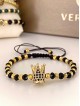Bratara dama model deosebit cu margele aurii si negre si coroana cu pietricele negre