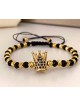 Bratara dama model deosebit cu margele aurii si negre si coroana cu pietricele negre